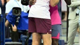 Alex Michelsen is consoled by Frances Tiafoe after falling to the 11th seed in five sets in the US Open quarter-finals