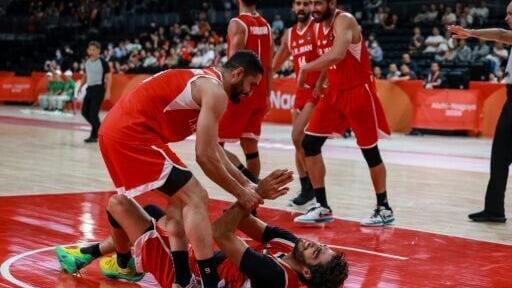 Iran's players celebrate winning the men's basketball bronze medal
