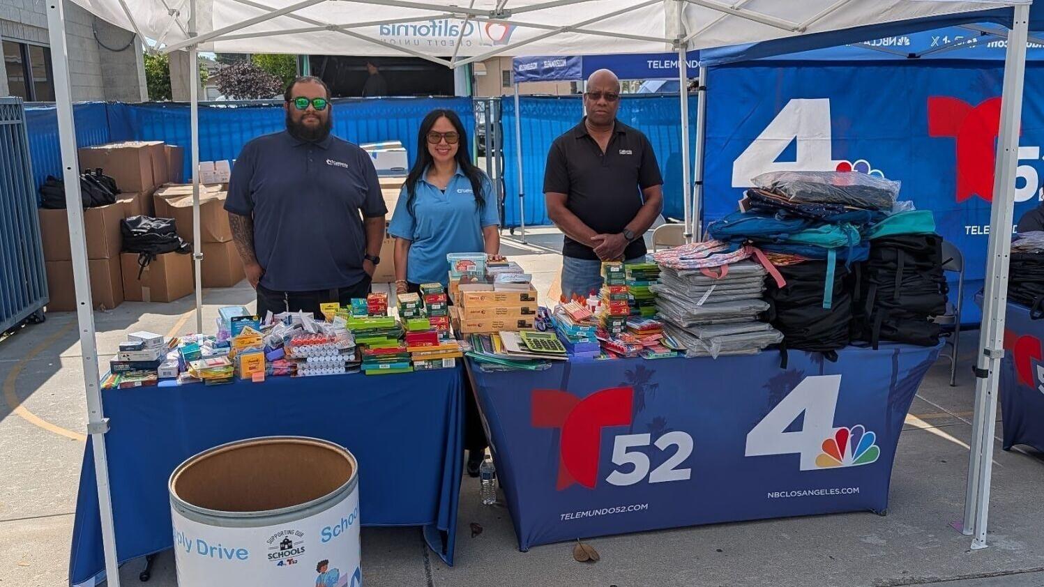(L-R) California Credit Union employees Walter Ramirez, Facilities; Claudia Gutierrez, Asset Management; and Fred Keys, Administrative Services, stand with backpacks and school supplies donated through the credit union’s annual drive in support of NBC4 ...