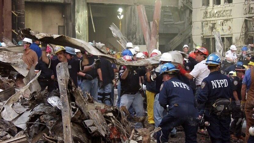 World Trade Center responders work amid the debris at Ground Zero following the Sept. 11 attacks. FIU researcher Roberto Lucchini studies how the toxic exposures and psychological trauma responders experienced may affect their health decades later. Phot...