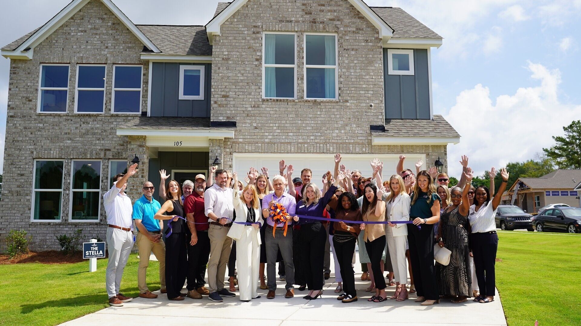 Pictured are Tammy Zink, Division President, and Mayor Ron Anders, along with Davidson Homes team members, Chamber members, and Chamber Ambassadors who joined for the celebration.