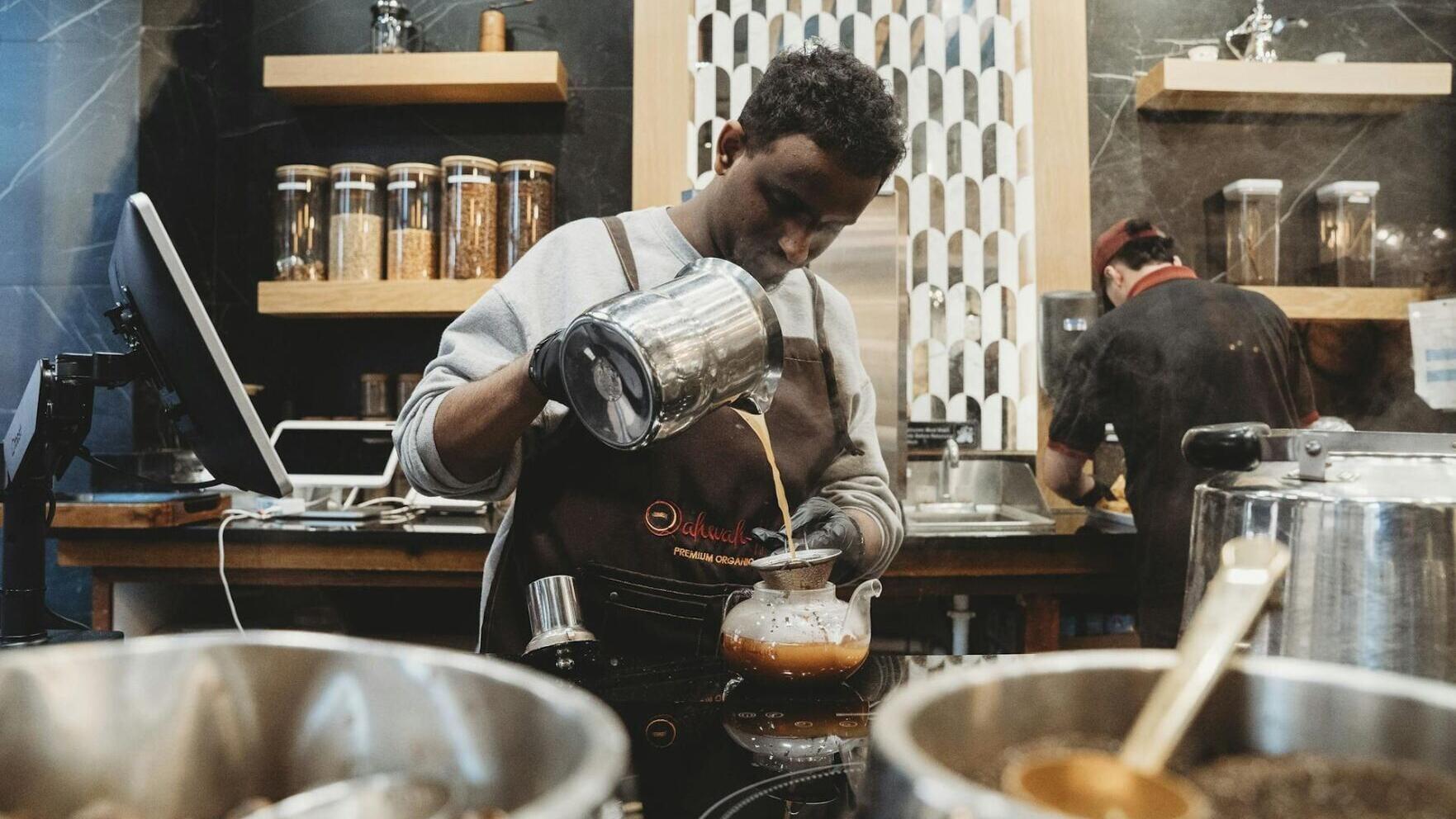 A barista prepares drinks at Qahwah House in Dearborn, Mich.