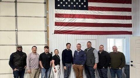 Team members from IDI, Insulation Distributors, Inc. and Design North Supply mark the start of a new chapter together.
