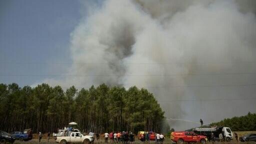 While spirits were high among the helpers, many expressed frustration at the state's response to a blaze