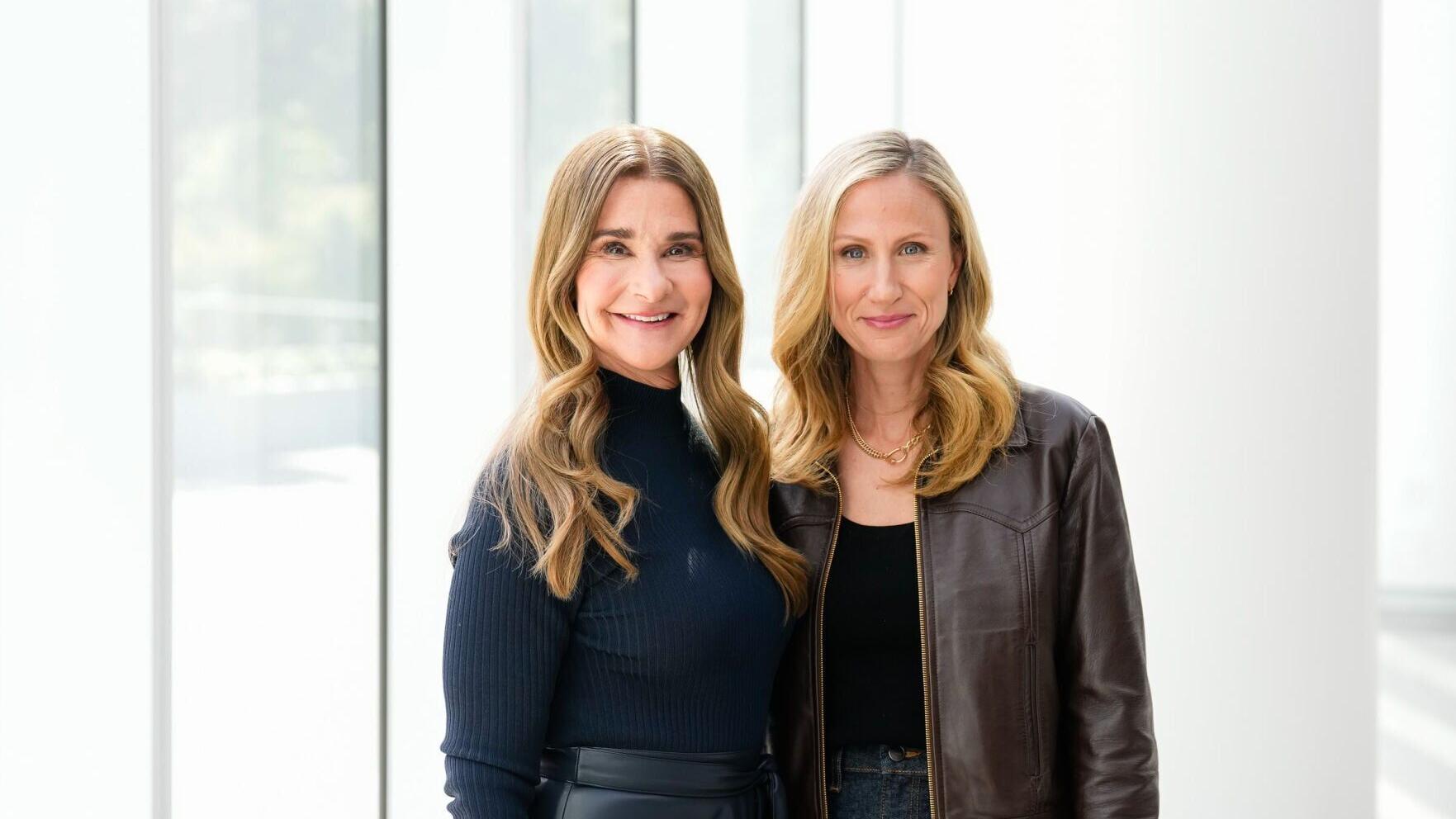 One Roof Sports and Entertainment's majority owner and managing partner, Samantha Holloway and Melinda French Gates pose for a photo.