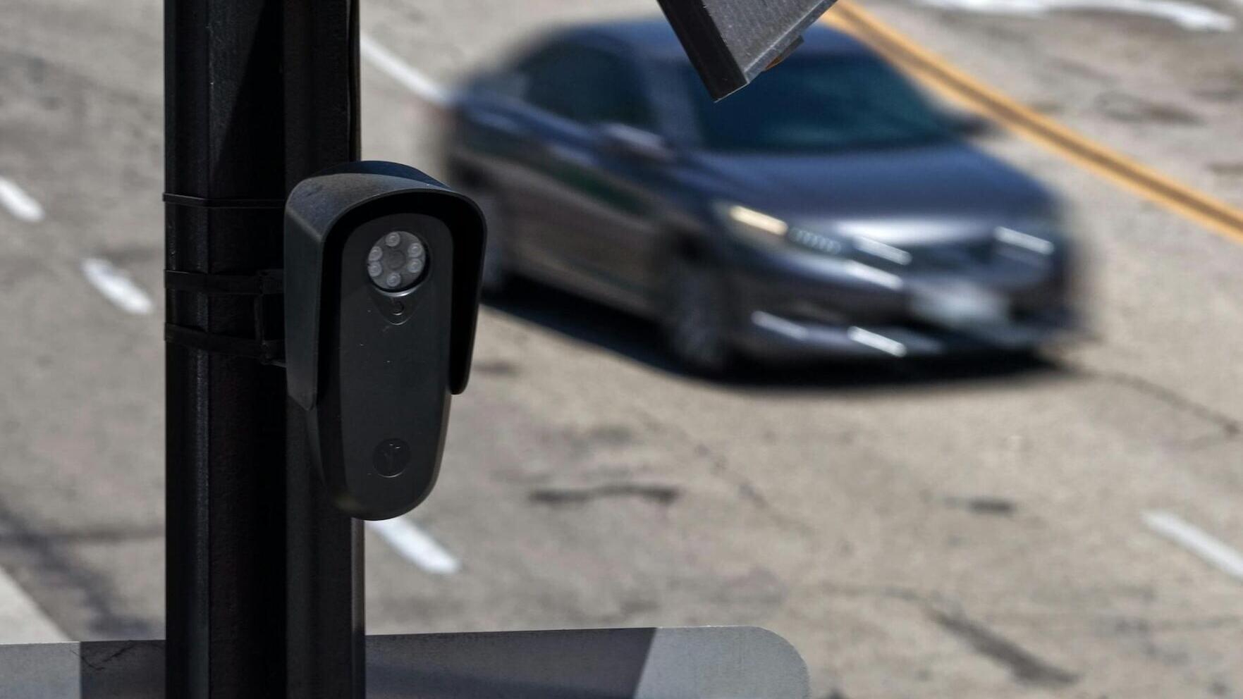 License plate readers like this one could soon be joined by sensors that detect phones inside passing cars.