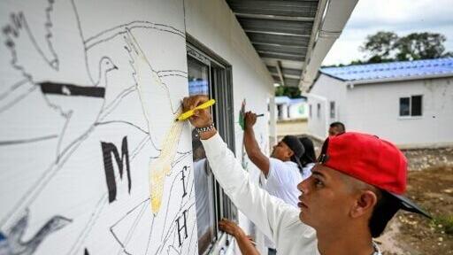 The fate of some 100 ex-guerrillas is uncertain as Colombia's left-wing government is replaced by a bellicose right-wing one