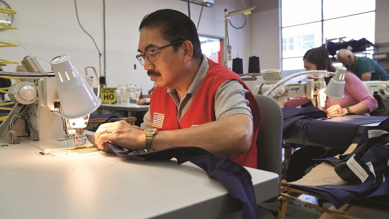 North Bay Industries employees including Jamie Rivera sew military uniforms and interment flags
