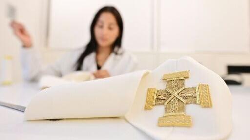 A team of seamstresses adorn the liturgical vestments with rich embroidery.