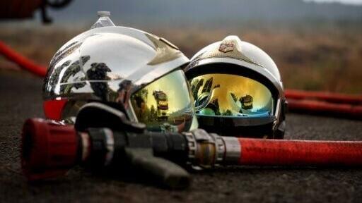 In the village of Saint-Jean d'Illac, drizzle offered a little welcome respite to firefighters