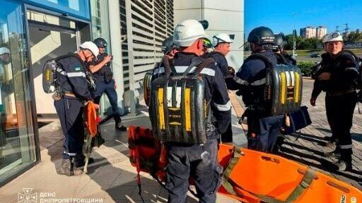 Rescuers at the site of the damaged shopping centre in Ukraine