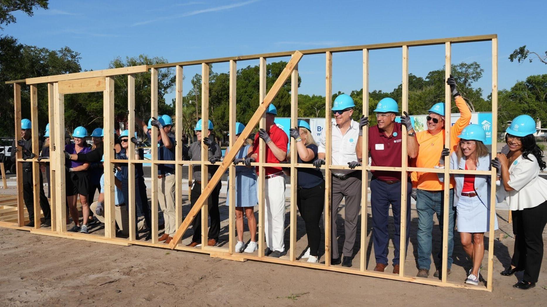 Habitat marked the continued development of Legacy Square with a wall raising to celebrate the launch of Phase Two construction for the 19-home development.