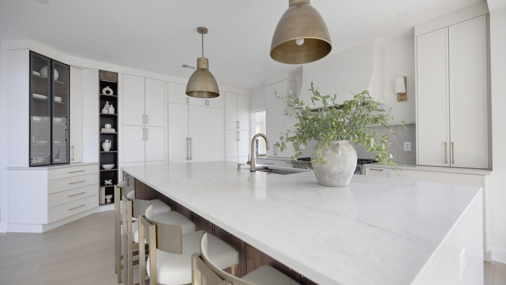 Winner of the 2026 Crystal Cabinet Works Design Award: EA Home Design transformed this divided Chantilly, Virginia main floor into a bright open-concept kitchen by removing two load-bearing walls. The design pairs two-tone Crystal Cabinets - Alabaster p...