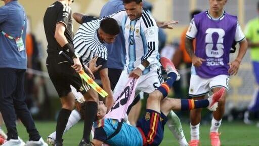Argentina's Leandro Paredes (centre) clashes with Spain midfielder Gavi after the World Cup final