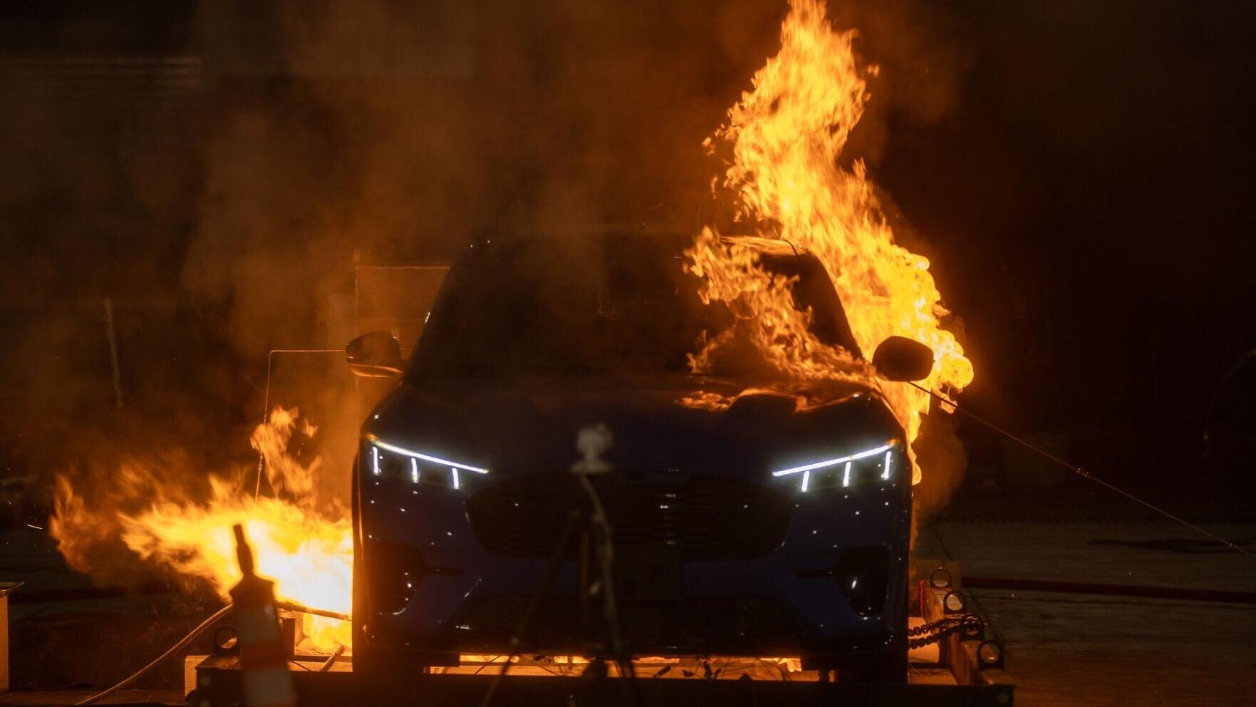 An electric vehicle burns during tests conducted by UL Research Institutes' Fire Safety Research Institute.