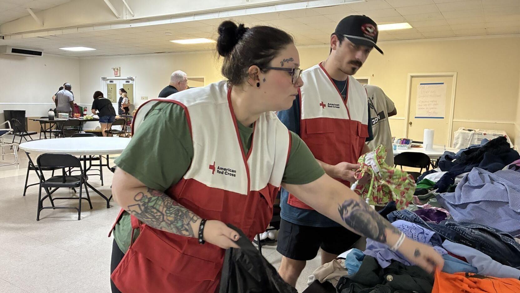 Red Cross volunteers set up shelter for flood victims