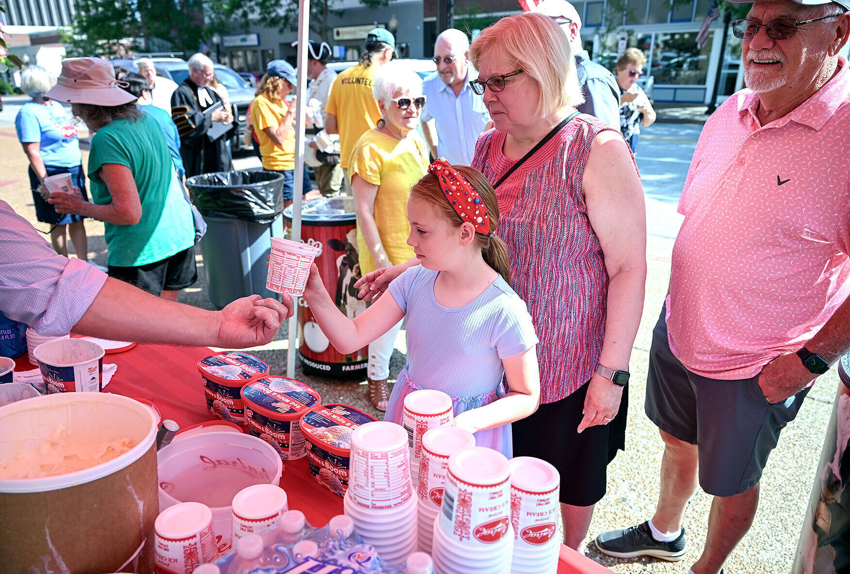Sophia Adams, 8, of Russellville, Missouri, gets ice cream