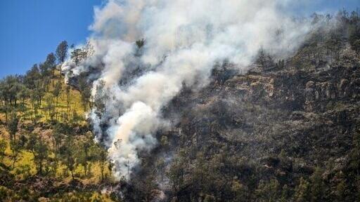 A wildfire burns in Bromo Tengger Semeru National Park near Mount Bromo in Probolinggo, East Java