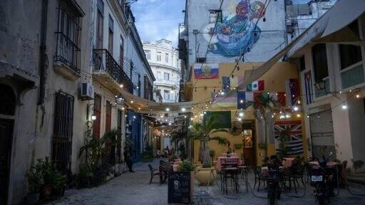 Empty tables at a restaurant in Old Havana are seen amid a lack of tourists and an exodus of residents deeply uncertain about Cuba's future