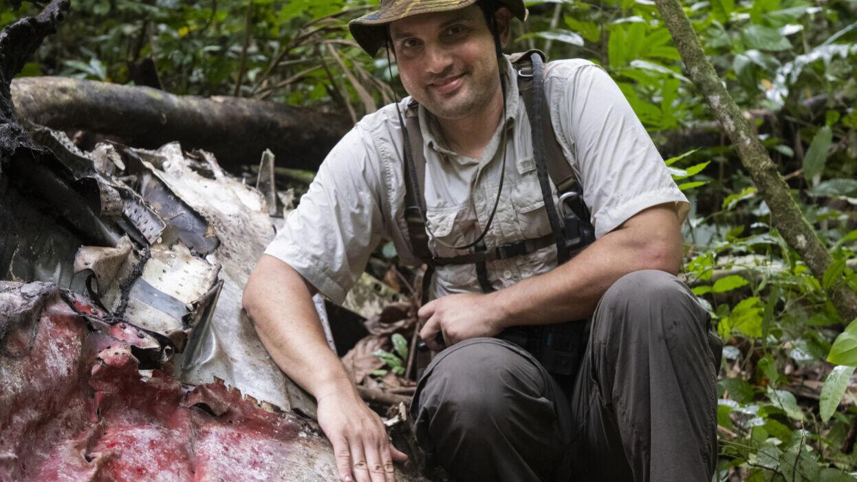 Justin Taylan, Director of Pacific Wrecks, at the crash site of P-38J Lightning “Marge” 42-103993 upon discovery in the jungle of New Guinea. PHOTO: PACIFIC WRECKS/JOEL CARILLET
