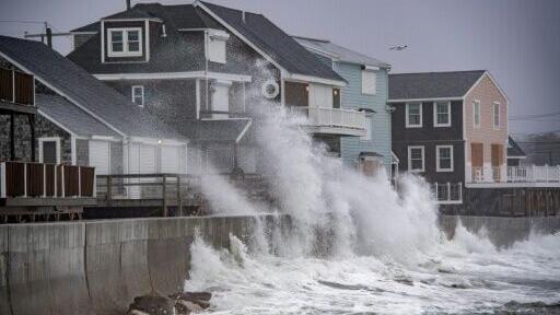 Waves pound the coast as the tide comes in during a Nor'easter storm in Scituate, Massachusetts