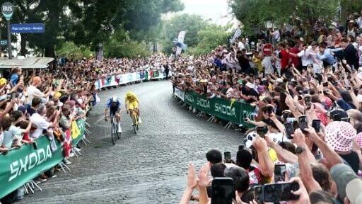 Mathoieu van der Poel (L) and Tadej Pogacar (R) broke clear on the Montmartre climb packed with fans