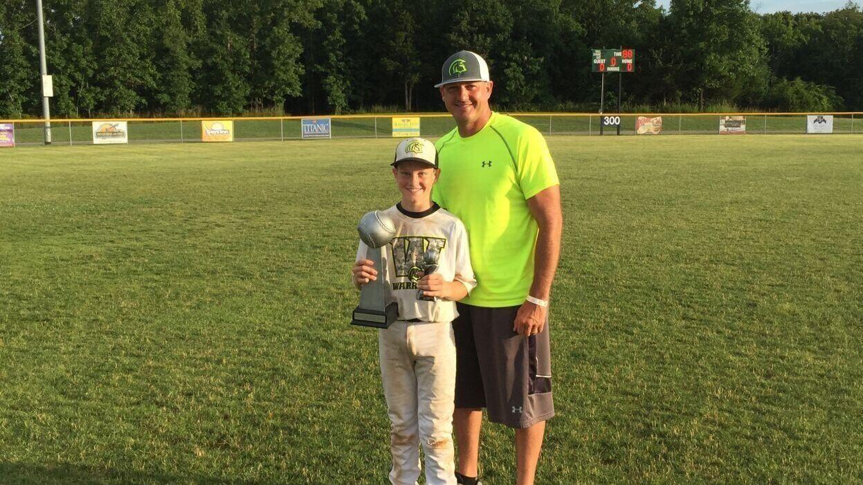 Bryce and young Kam with tournament trophies