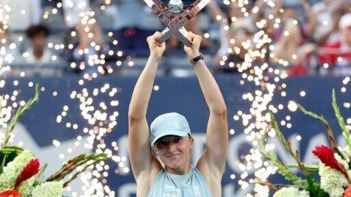 Poland's Iga Swiatek celebrates her WTA 1000 victory in Toronto after beating Elena Rybakina in the final