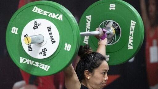 Mirabai Chanu trains at a gym in New Delhi ahead of the Asian Games in Nagoya-Aichi