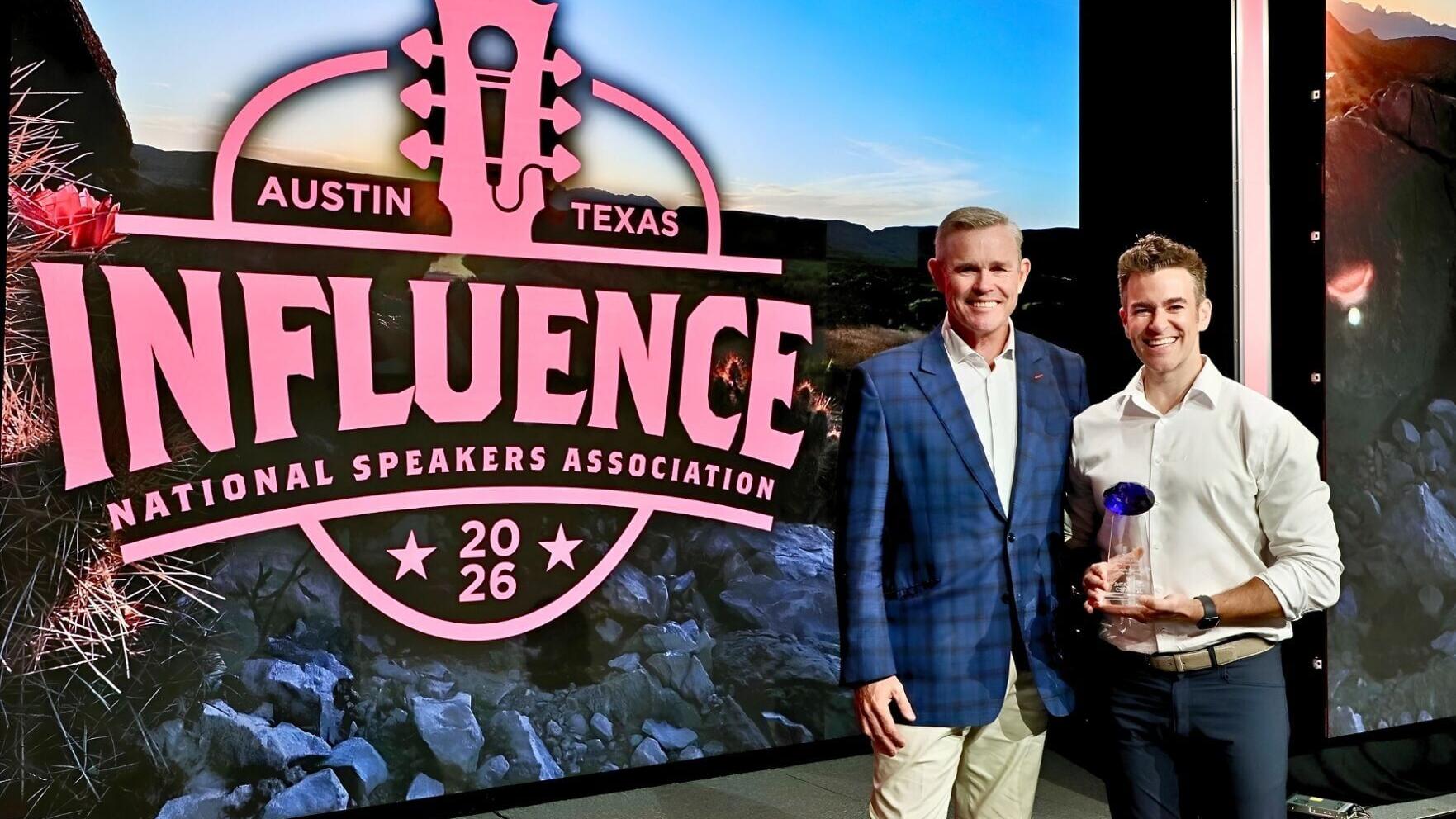 Jeff Civillico accepts the Nido R. Qubein Philanthropist of the Year Award from Patrick Henry, chair of the National Speakers Association Foundation Board of Trustees, at the Influence 2026 conference in Austin, Texas, on July 26, 2026. *Photo: Russell ...