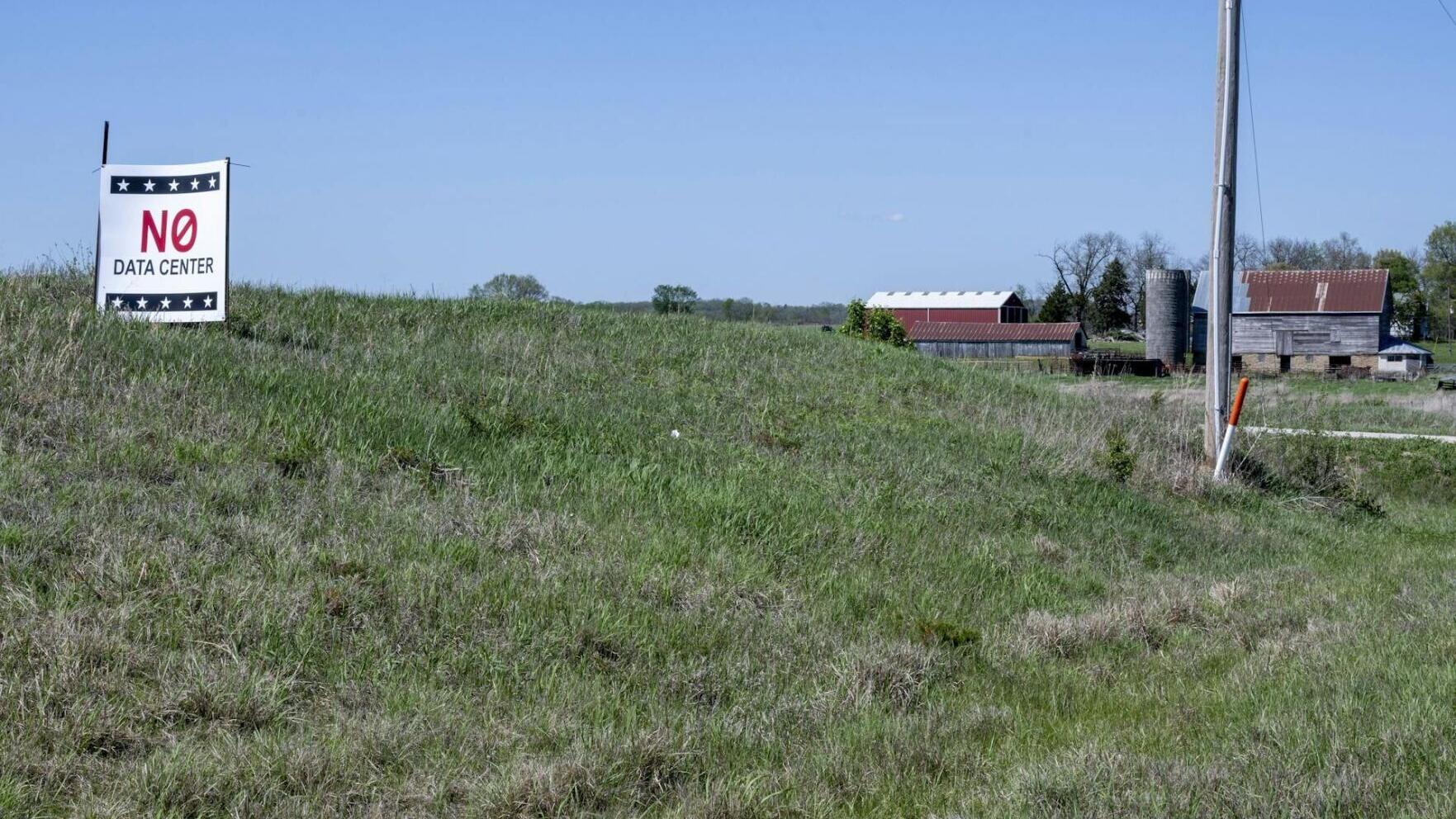 A sign in a small town in Kansas opposes a proposal for a data center nearby.