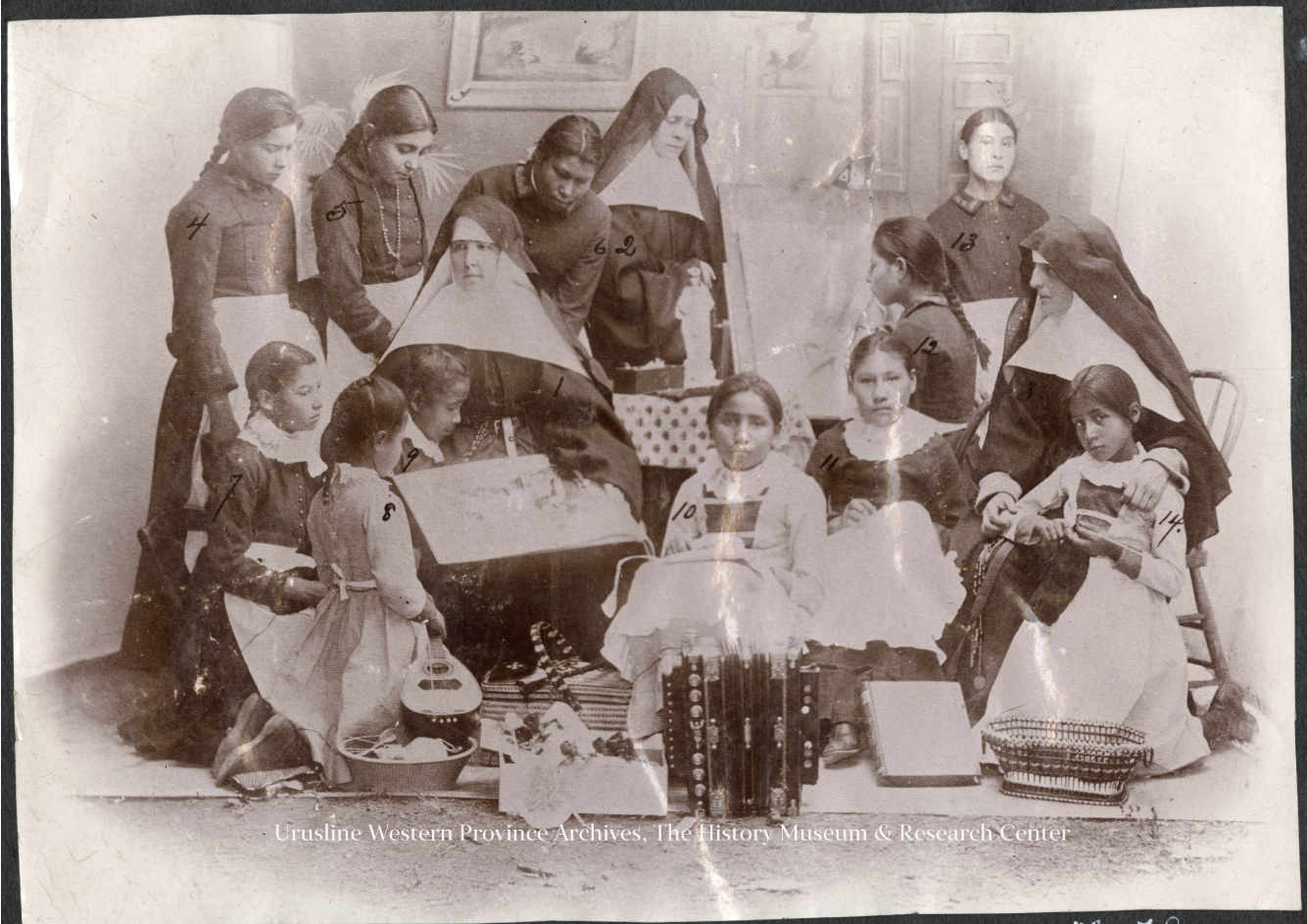 nuns with Native American children