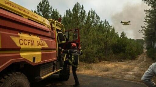 France braced for hotter weather that it is feared could fan the flames further