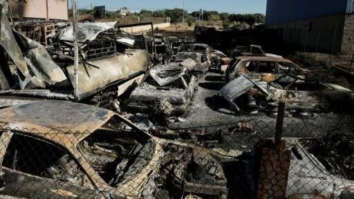 Cars were burned out by the flames in Chapineria, Spain