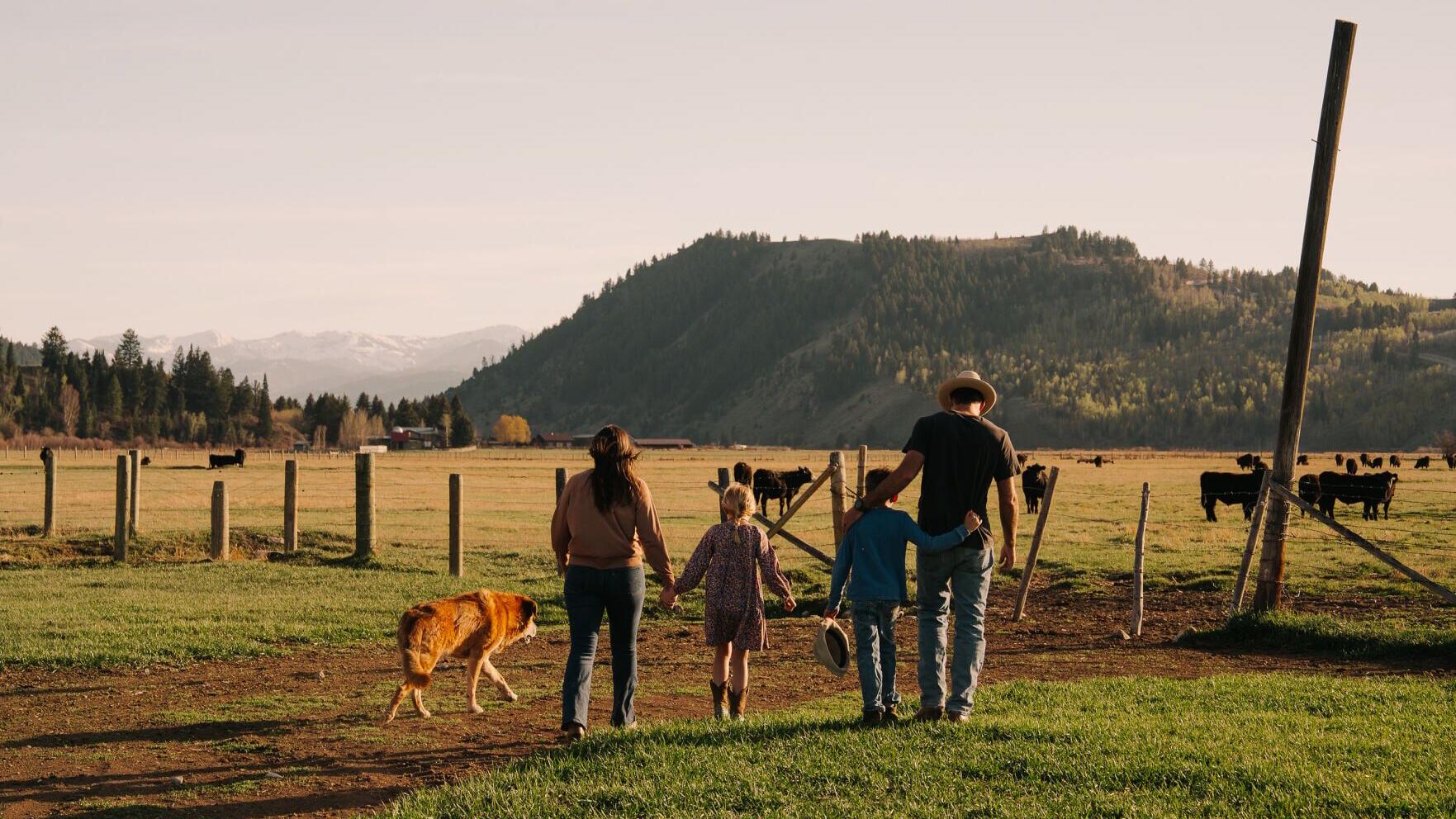 Sam Mead with his wife and two children, who are growing up on the same Wyoming ranch that has been home to the Mead family for six generations.