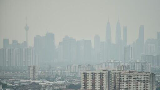 Haze shrouds the Kuala Lumpur skyline on August 26 amid high levels of air pollution from regional wildfires