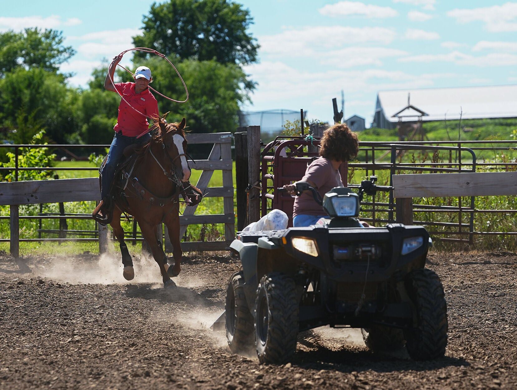 Kail Wood, 15, left, practices breakaway roping