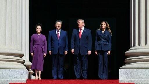 US President Donald Trump, First Lady Melania Trump, China's President Xi Jinping and his wife Peng Liyuan stand together as they arrive to visit the National Archives in Washington