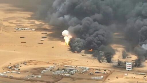 This image released by Houthi forces purportedly shows a ballistic missile strike on trucks carrying military equipment from Saudi Arabia to Yemen